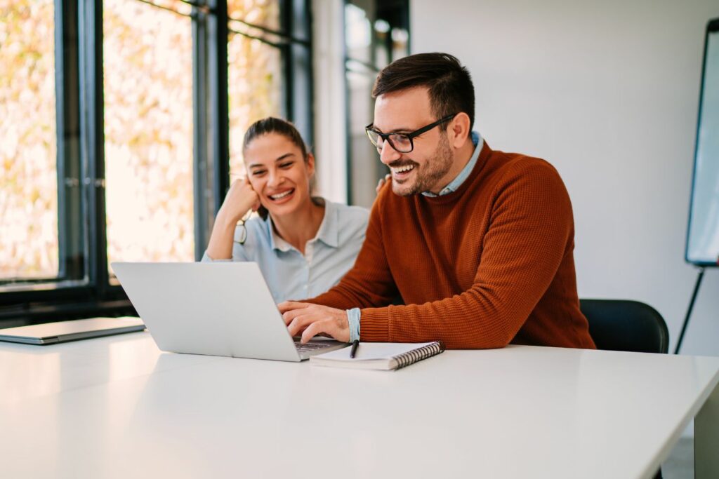 coworkers working on computer together